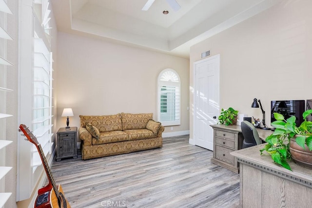 30801 Via Conquista, San Juan Capistrano, CA 92675 - office with light wood-style flooring, a raised ceiling, a ceiling fan, and baseboards