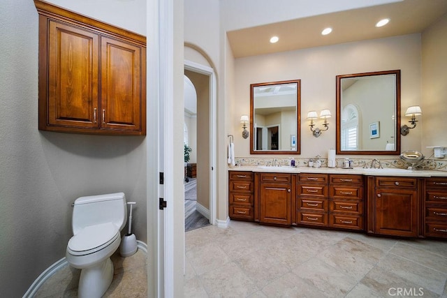 30801 Via Conquista, San Juan Capistrano, CA 92675 - bathroom featuring double vanity, toilet, recessed lighting, baseboards, and tile patterned flooring