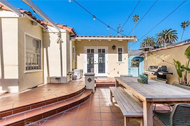 209 Ximeno Ave, Long Beach, CA 90803 - back of house featuring french doors, stucco siding, a patio, and a tiled roof