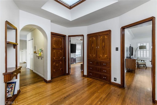 209 Ximeno Ave, Long Beach, CA 90803 - hall featuring wood finished floors, baseboards, and arched walkways