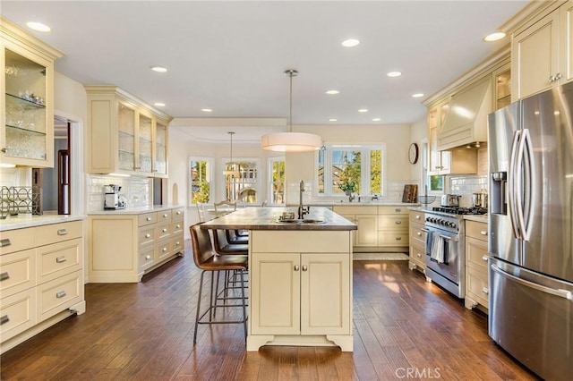 209 Ximeno Ave, Long Beach, CA 90803 - kitchen featuring cream cabinets, appliances with stainless steel finishes, custom exhaust hood, backsplash, and recessed lighting