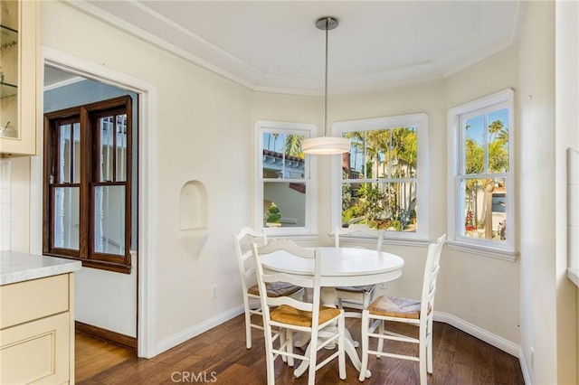 209 Ximeno Ave, Long Beach, CA 90803 - dining room featuring dark wood finished floors, baseboards, and crown molding