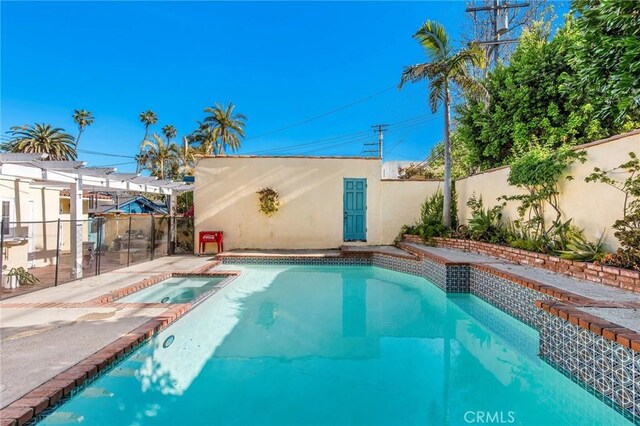 209 Ximeno Ave, Long Beach, CA 90803 - view of swimming pool featuring an in-ground hot tub and a fenced backyard