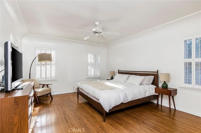 209 Ximeno Ave, Long Beach, CA 90803 - bedroom with multiple windows, wood finished floors, baseboards, and a ceiling fan