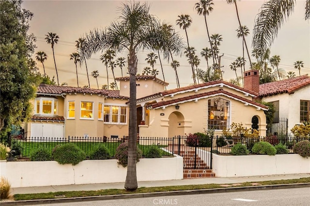 209 Ximeno Ave, Long Beach, CA 90803 - mediterranean / spanish house with stucco siding, a tile roof, and a fenced front yard