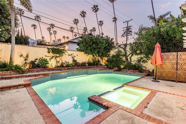 209 Ximeno Ave, Long Beach, CA 90803 - view of pool with a pool with connected hot tub, a fenced backyard, and a patio