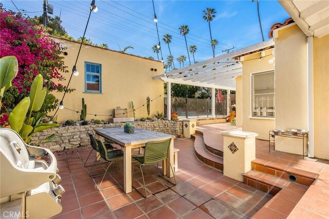209 Ximeno Ave, Long Beach, CA 90803 - view of patio featuring outdoor dining space and a pergola
