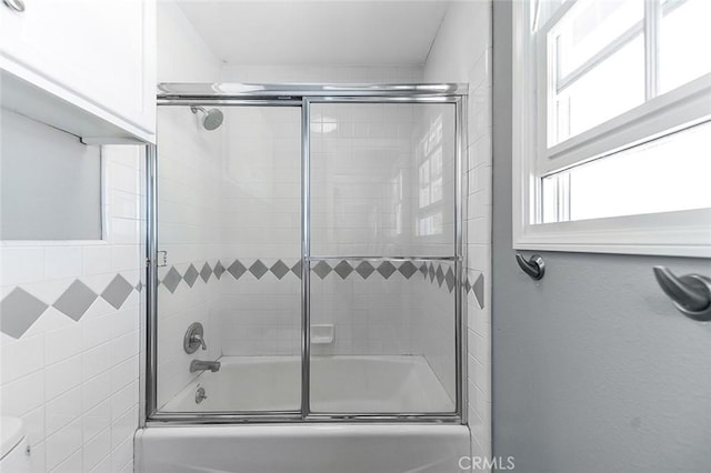 435 Orlena Ave, Long Beach, CA 90814 - bathroom featuring bath / shower combo with glass door, toilet, and tile walls