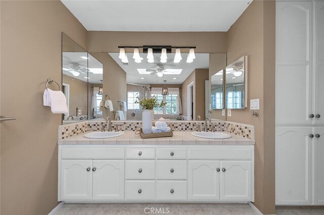 435 Orlena Ave, Long Beach, CA 90814 - bathroom with a ceiling fan, a skylight, and double vanity