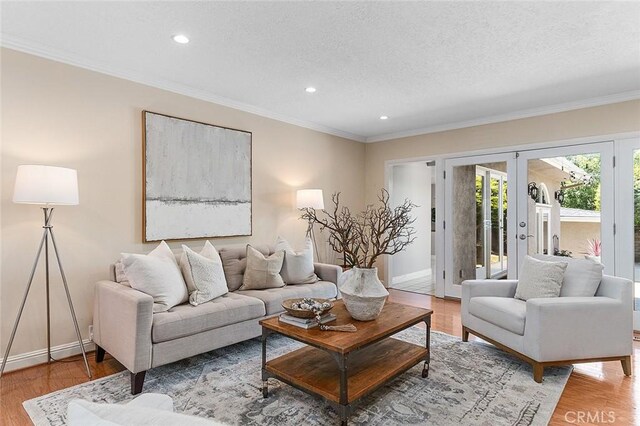 435 Orlena Ave, Long Beach, CA 90814 - living area with light wood-style flooring, recessed lighting, ornamental molding, french doors, and baseboards