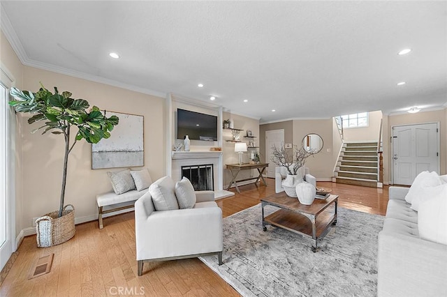 435 Orlena Ave, Long Beach, CA 90814 - living area with crown molding, stairway, light wood-style floors, recessed lighting, and baseboards