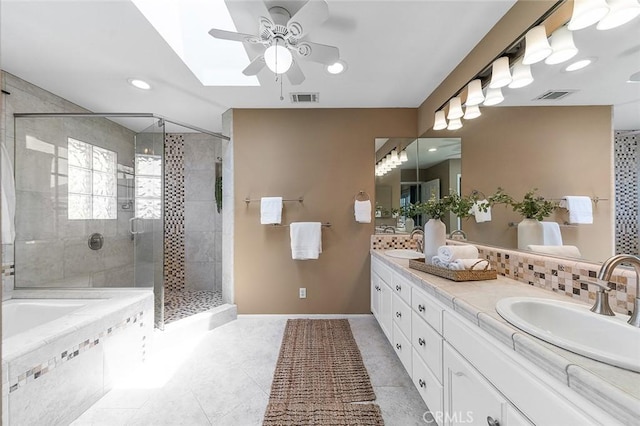 435 Orlena Ave, Long Beach, CA 90814 - bathroom with ceiling fan, double vanity, a garden tub, a stall shower, and tile patterned flooring