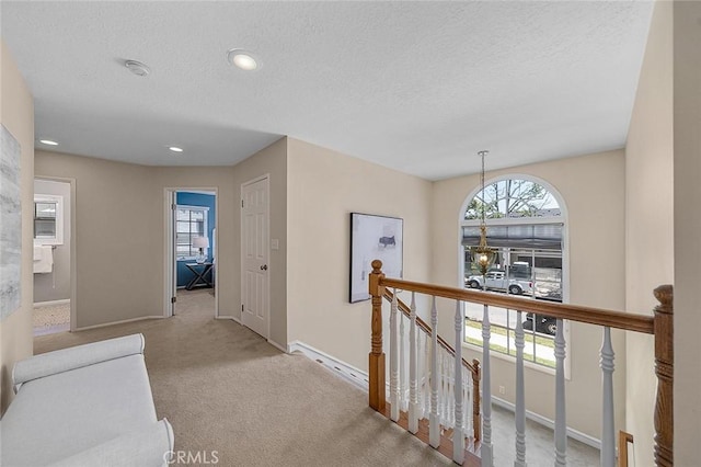 435 Orlena Ave, Long Beach, CA 90814 - hall with an upstairs landing, baseboards, carpet flooring, a textured ceiling, and recessed lighting