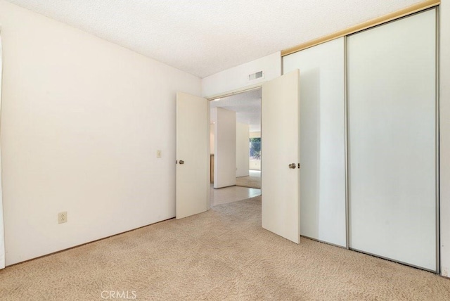 2740 Whitney St, San Diego, CA 92111 - unfurnished bedroom featuring light carpet and a closet