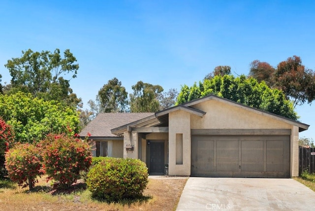 2740 Whitney St, San Diego, CA 92111 - view of front of property featuring stucco siding, an attached garage, and concrete driveway