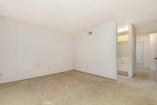 2740 Whitney St, San Diego, CA 92111 - unfurnished room with light carpet and a textured ceiling