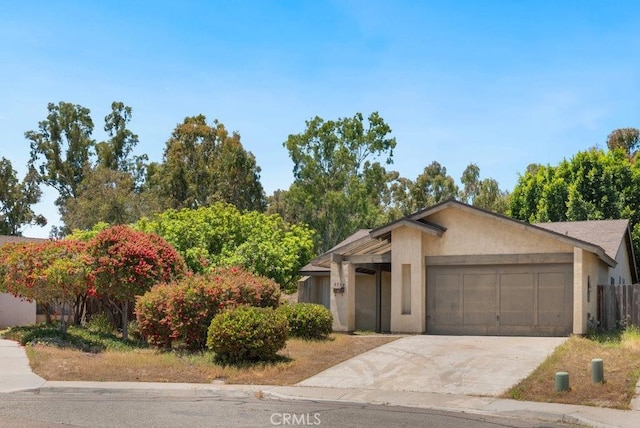 2740 Whitney St, San Diego, CA 92111 - view of front of house with a garage, driveway, and stucco siding