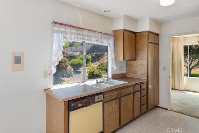 2740 Whitney St, San Diego, CA 92111 - kitchen with dishwasher, a sink, brown cabinets, and light countertops