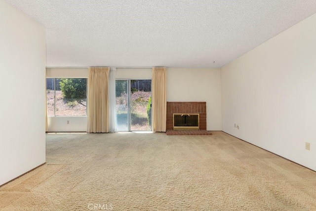 2740 Whitney St, San Diego, CA 92111 - unfurnished living room with carpet, a textured ceiling, and a fireplace
