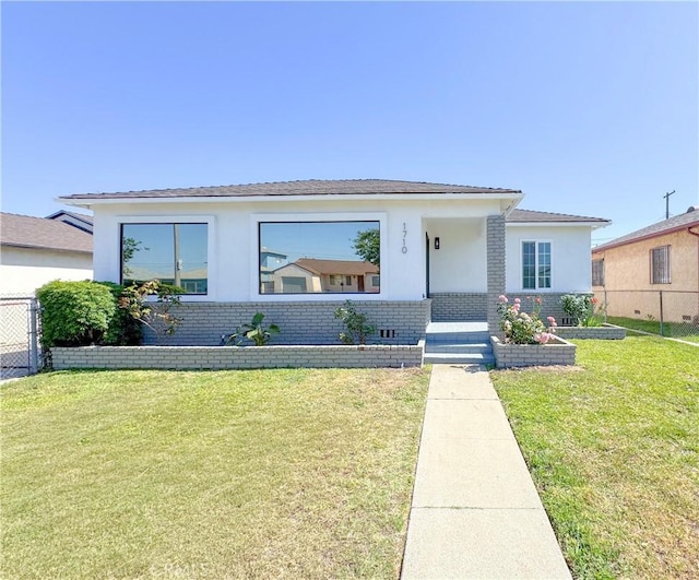 1710 W Arbutus St, Compton, CA 90220 - view of front facade with stucco siding and brick siding