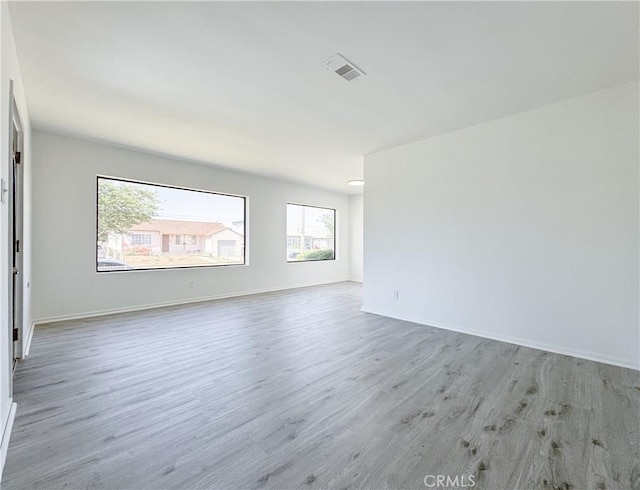 1710 W Arbutus St, Compton, CA 90220 - unfurnished room with wood finished floors and baseboards