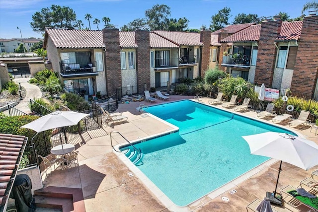 1905 Alga Rd Unit C, Carlsbad, CA 92009 - community pool featuring a patio area and a residential view