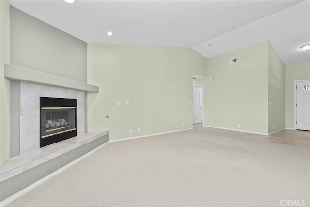 917 Saint Ann, Paso Robles, CA 93446 - unfurnished living room with lofted ceiling, carpet floors, a tile fireplace, baseboards, and recessed lighting