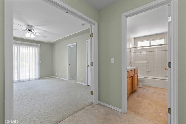 917 Saint Ann, Paso Robles, CA 93446 - hallway featuring baseboards, light tile patterned flooring, and light colored carpet