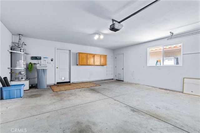 917 Saint Ann, Paso Robles, CA 93446 - garage featuring strapped water heater and a garage door opener