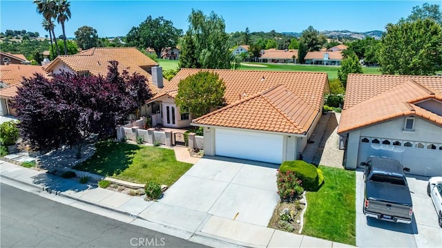 917 Saint Ann, Paso Robles, CA 93446 - view of front of house featuring a tiled roof, a residential view, concrete driveway, a front lawn, and a garage