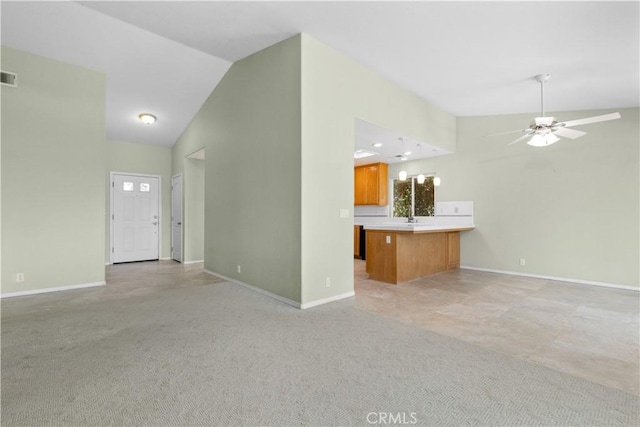 917 Saint Ann, Paso Robles, CA 93446 - unfurnished living room with a ceiling fan, baseboards, high vaulted ceiling, and light carpet