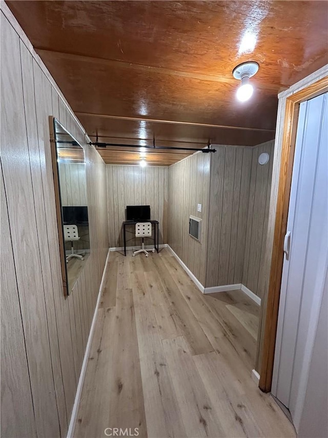 2484 Pine Dr, Running Springs, CA 92382 - unfurnished room featuring wood finished floors, wooden walls, wooden ceiling, baseboards, and an office area