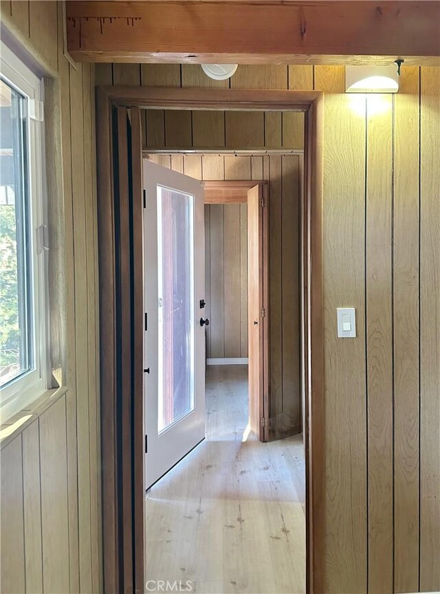 2484 Pine Dr, Running Springs, CA 92382 - hall with wooden walls and light wood finished floors