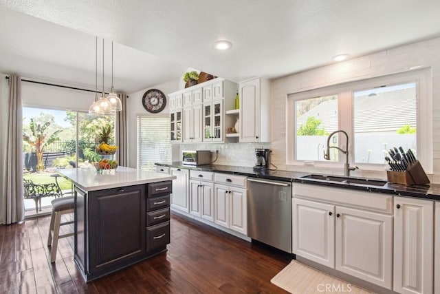 43650 Buckeye Rd, Temecula, CA 92592 - kitchen with dishwasher, white cabinetry, glass insert cabinets, healthy amount of natural light, and recessed lighting