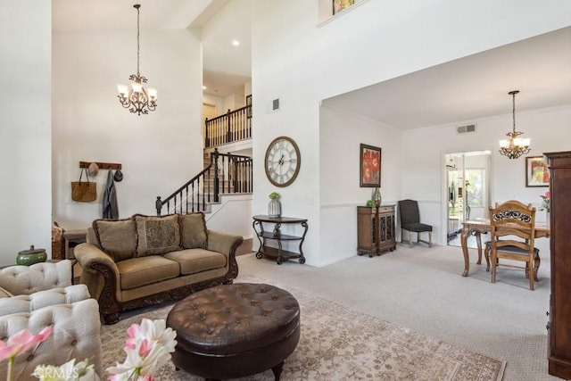 43650 Buckeye Rd, Temecula, CA 92592 - living area with a chandelier, carpet flooring, stairway, a high ceiling, and crown molding