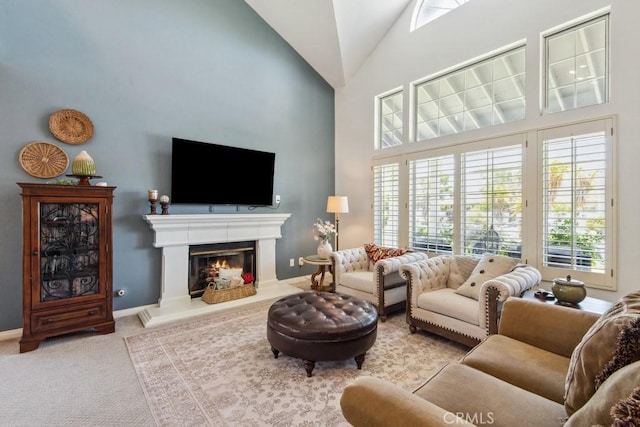 43650 Buckeye Rd, Temecula, CA 92592 - living area featuring carpet, high vaulted ceiling, and a glass covered fireplace