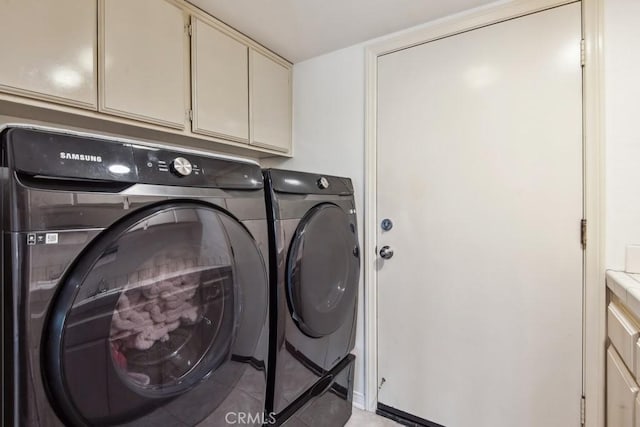 43650 Buckeye Rd, Temecula, CA 92592 - laundry area with washing machine and dryer and cabinet space