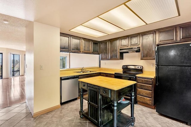 368 Travelodge Dr, El Cajon, CA 92020 - kitchen featuring black appliances, light countertops, light tile patterned flooring, under cabinet range hood, and dark brown cabinets