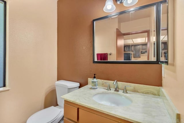 368 Travelodge Dr, El Cajon, CA 92020 - bathroom with toilet, vanity, and a textured wall