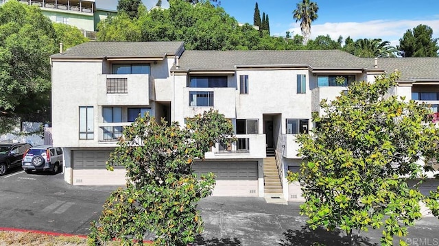 368 Travelodge Dr, El Cajon, CA 92020 - view of property with a garage and stairway