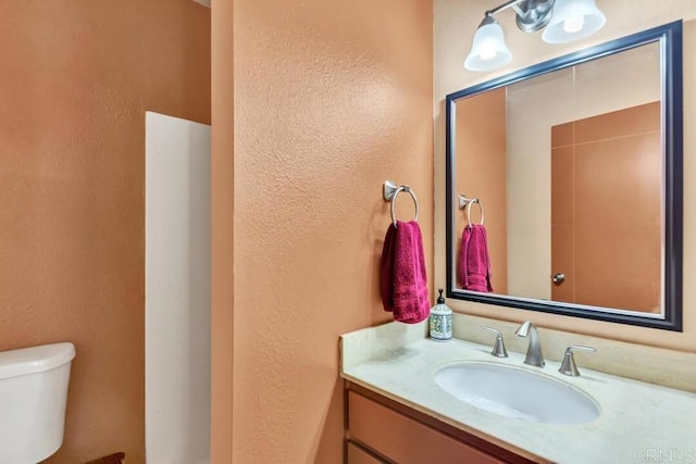 368 Travelodge Dr, El Cajon, CA 92020 - bathroom featuring toilet, a textured wall, and vanity