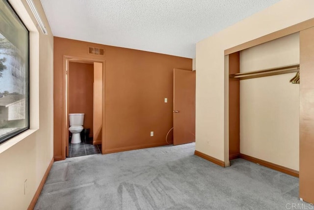 368 Travelodge Dr, El Cajon, CA 92020 - unfurnished bedroom with a closet, carpet flooring, a textured ceiling, baseboards, and ensuite bath