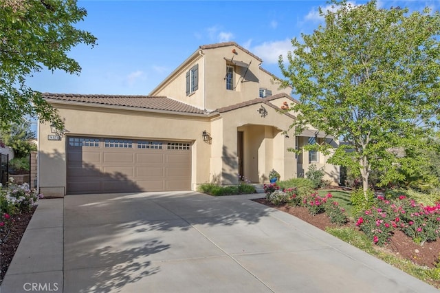 24923 Hearth Ct, Valencia, CA 91354 - mediterranean / spanish house with stucco siding, concrete driveway, a garage, and a tile roof