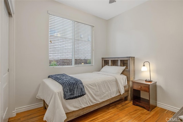 24923 Hearth Ct, Valencia, CA 91354 - bedroom with multiple windows, baseboards, and light wood-type flooring