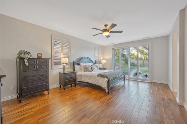 24923 Hearth Ct, Valencia, CA 91354 - bedroom featuring access to outside, light wood-type flooring, baseboards, and a ceiling fan
