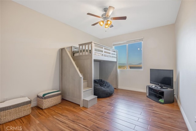 24923 Hearth Ct, Valencia, CA 91354 - bedroom featuring wood finished floors, baseboards, and a ceiling fan