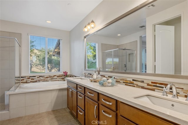 24923 Hearth Ct, Valencia, CA 91354 - bathroom with a stall shower, double vanity, healthy amount of natural light, and a garden tub