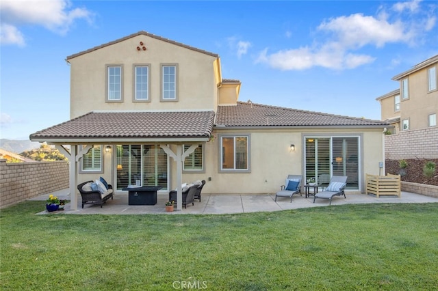 24923 Hearth Ct, Valencia, CA 91354 - rear view of house with a tiled roof, stucco siding, and a patio area