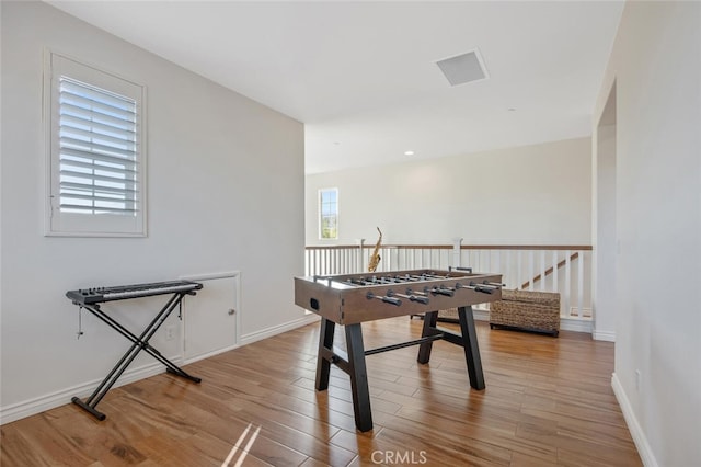 24923 Hearth Ct, Valencia, CA 91354 - playroom featuring wood finished floors and baseboards