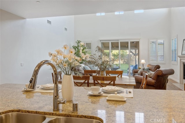 24923 Hearth Ct, Valencia, CA 91354 - detailed view of light stone counters and a fireplace